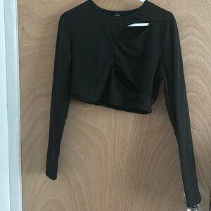 Black crop top with a cut in the front